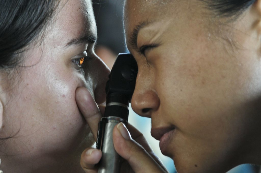 Optometrist with patient