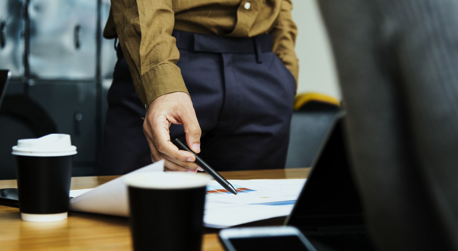 A man pointing at documents