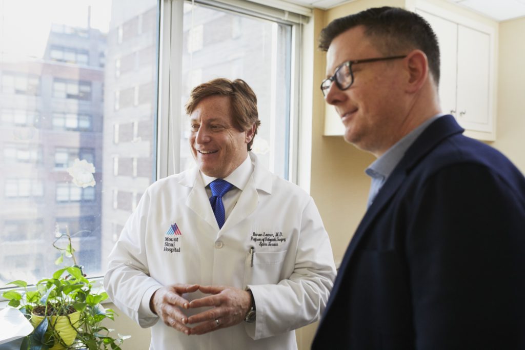 Doctor next to man