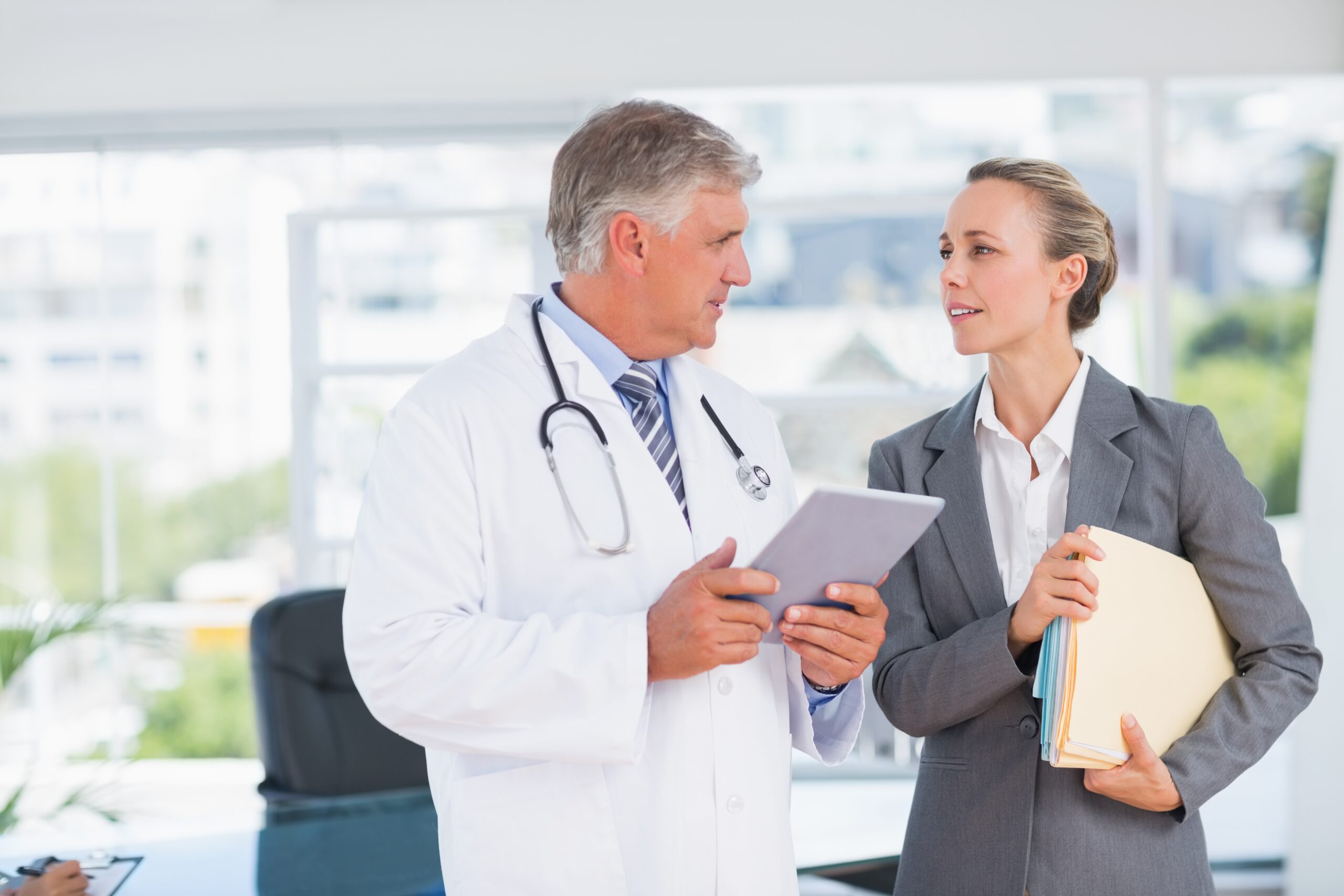 Doctor with colleague discussing clinical trial