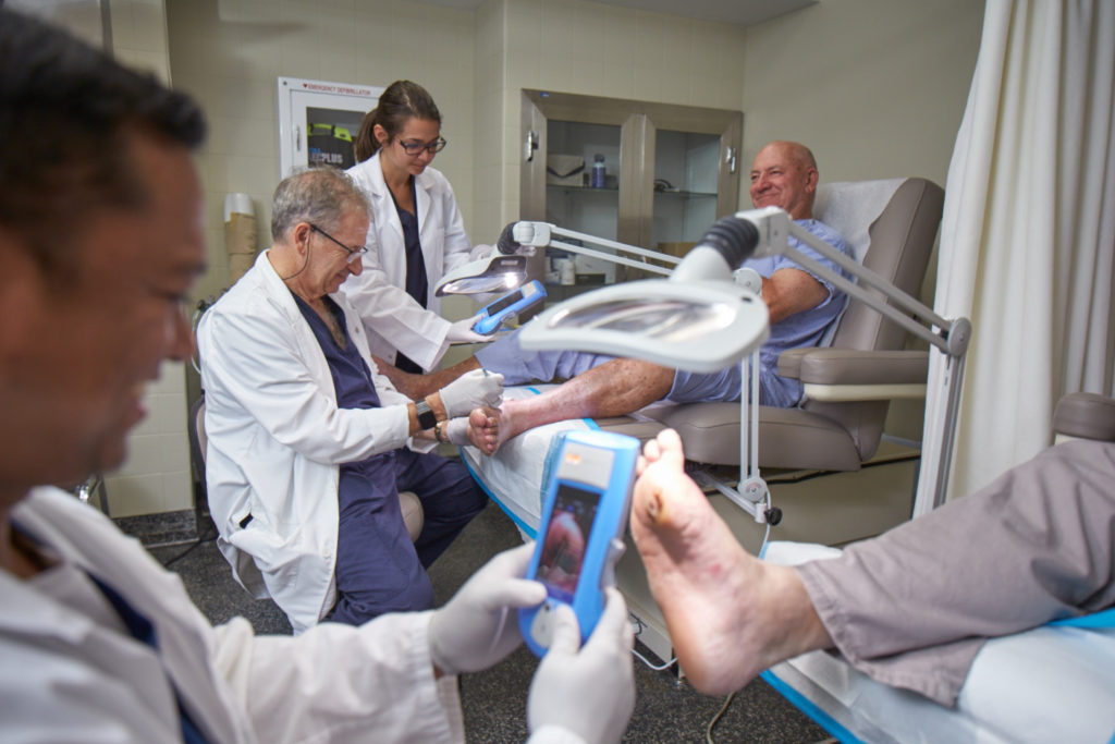 Fluorescence imaging device is used on diabetic foot ulcers to assess the bacterial loads in the wounds.